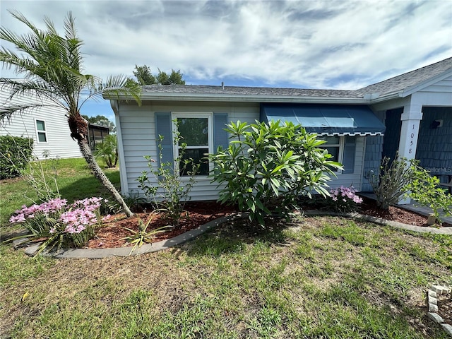 view of property exterior with a yard