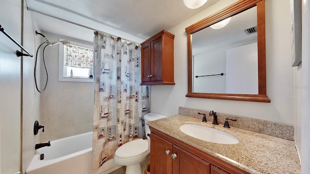 full bathroom with vanity, shower / bath combination with curtain, and toilet