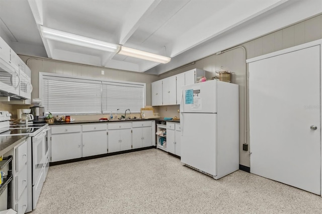 kitchen with sink, white cabinets, and white appliances