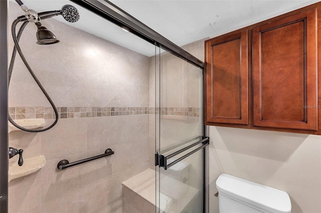 full bath with toilet and a stall shower