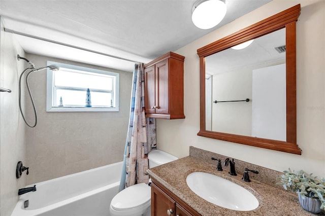 bathroom with vanity, shower / bath combo with shower curtain, toilet, and visible vents