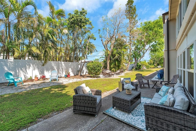view of patio / terrace featuring fence and an outdoor hangout area