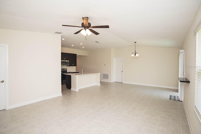 unfurnished living room featuring light tile patterned floors, ceiling fan with notable chandelier, lofted ceiling, and sink