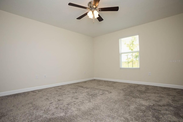 carpeted empty room with ceiling fan