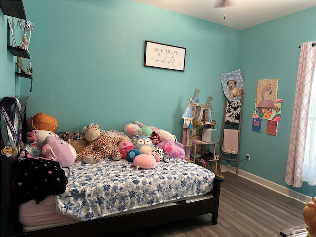 2875 Creeks Crossing Blvd, Lakeland, FL 33810 - bedroom with baseboards and wood finished floors