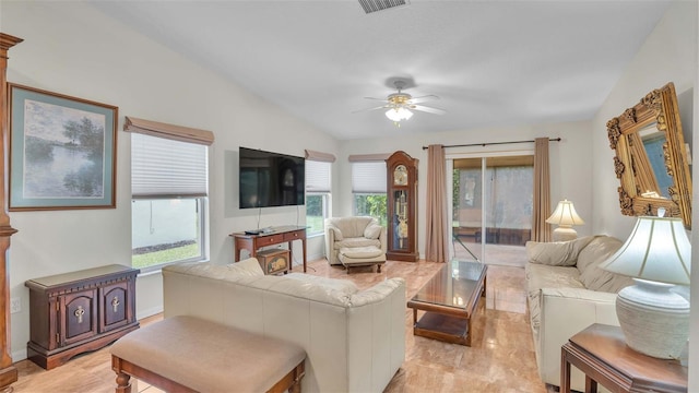 living room featuring ceiling fan and lofted ceiling