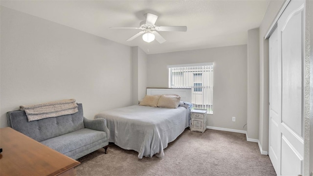 bedroom with carpet flooring, ceiling fan, and a closet