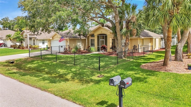 ranch-style house featuring a garage and a front yard