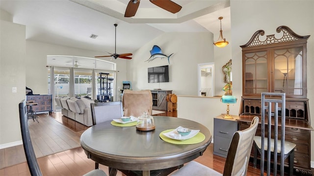 dining area featuring lofted ceiling and ceiling fan