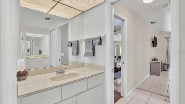 bathroom featuring vanity and tile patterned floors