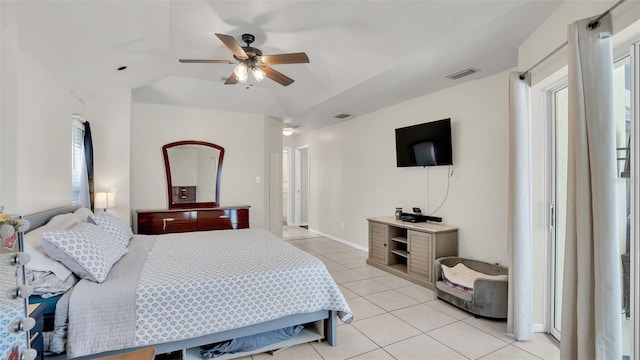 tiled bedroom with ceiling fan and vaulted ceiling