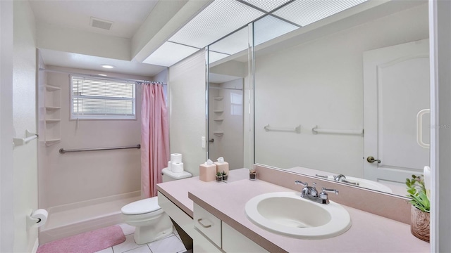 bathroom featuring tile patterned flooring, vanity, curtained shower, and toilet