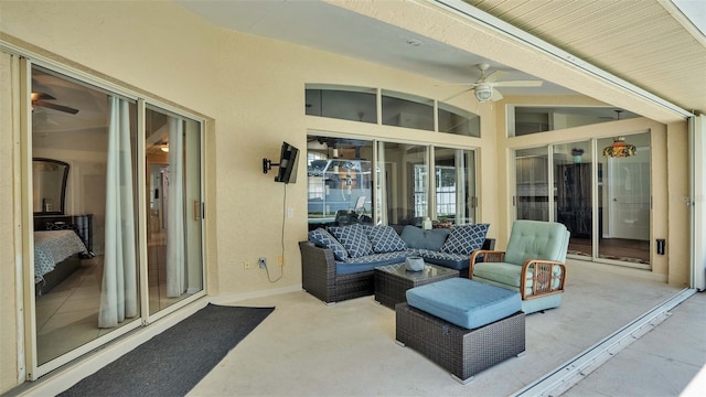 view of patio with an outdoor living space and ceiling fan