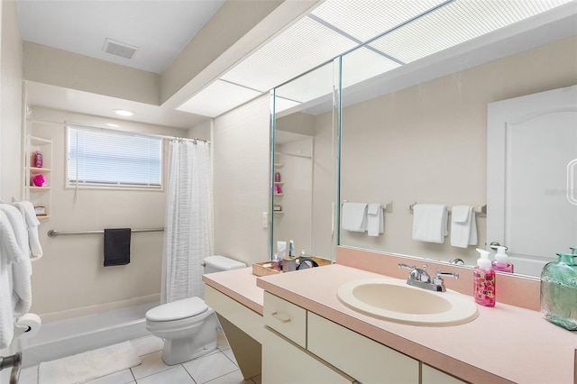 bathroom with a stall shower, toilet, visible vents, tile patterned flooring, and vanity