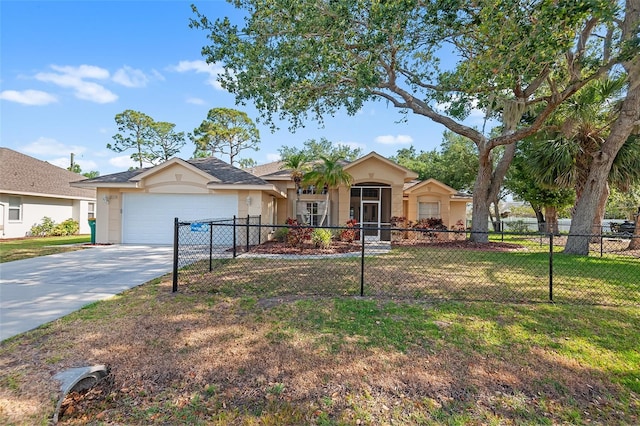 ranch-style home featuring a front lawn, stucco siding, an attached garage, and fence private yard