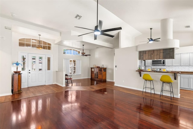 23338 Duchess Ave, Port Charlotte, FL 33954 - living area with ceiling fan, wood finished floors, and high vaulted ceiling