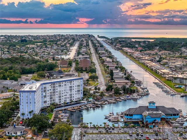 aerial view at dusk with a water view