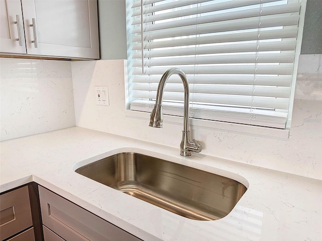 details with sink and light stone countertops