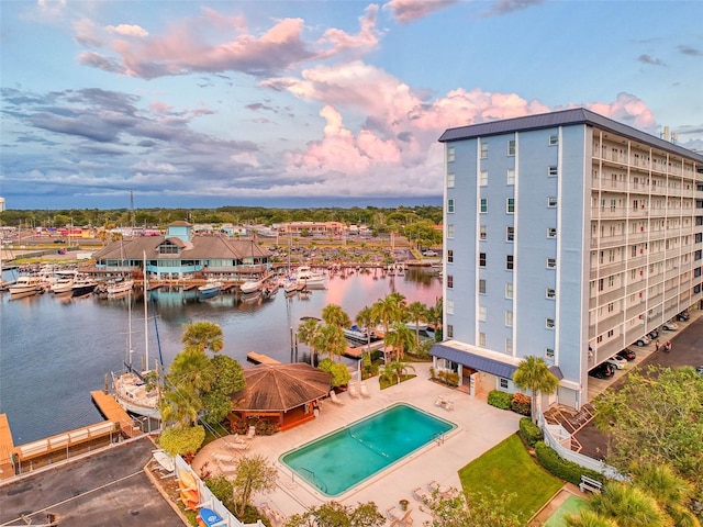 exterior space with a water view and a patio