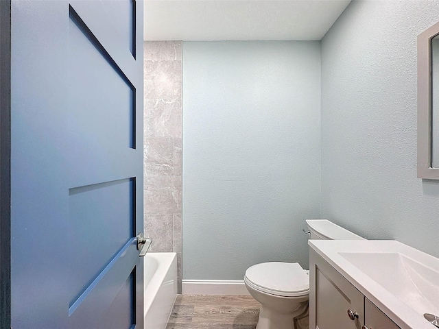 full bathroom featuring shower / tub combination, hardwood / wood-style flooring, large vanity, and toilet