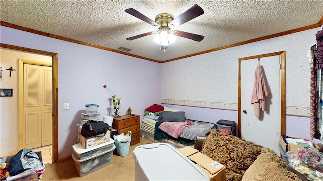 bedroom with ceiling fan, carpet, a textured ceiling, and ornamental molding