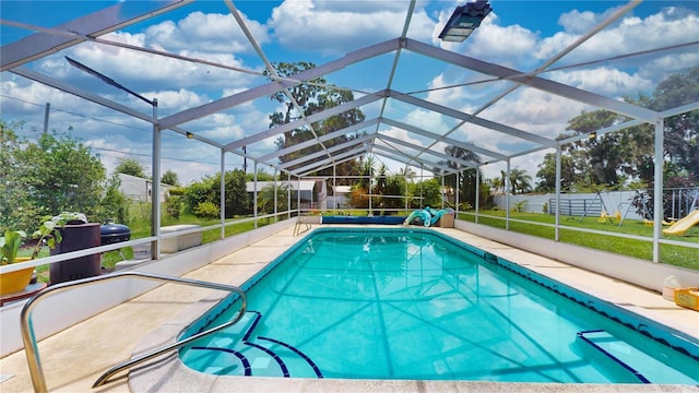 view of swimming pool with glass enclosure