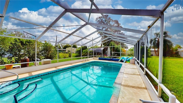 view of pool featuring a lanai and a yard