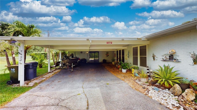 view of vehicle parking featuring a carport