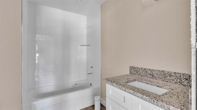 bathroom featuring shower / washtub combination and vanity