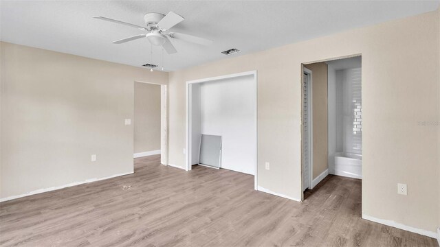 unfurnished bedroom with a closet, ceiling fan, and light hardwood / wood-style flooring