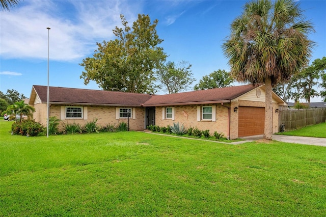 ranch-style home with a garage and a front lawn