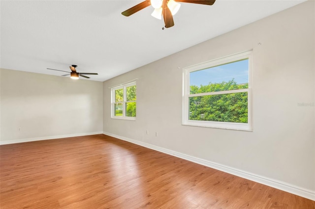 spare room featuring ceiling fan and light wood-type flooring