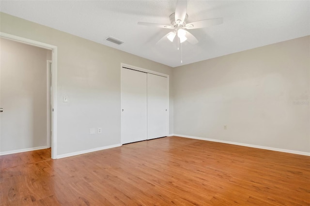 unfurnished bedroom featuring a closet, ceiling fan, and light hardwood / wood-style floors