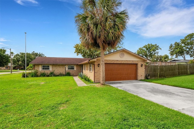 ranch-style home with a garage and a front lawn