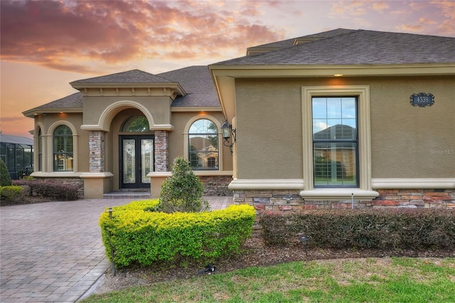 exterior entry at dusk with french doors