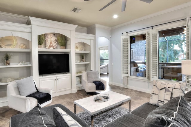 living room with a wealth of natural light and light tile patterned flooring