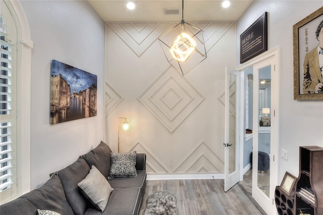 living room with french doors and wood-type flooring