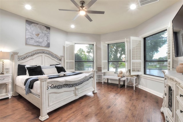 bedroom with ceiling fan and dark hardwood / wood-style flooring