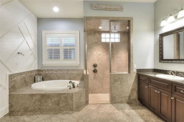 bathroom featuring vanity and separate shower and tub