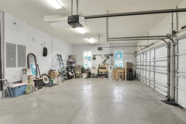 garage featuring electric panel and a garage door opener