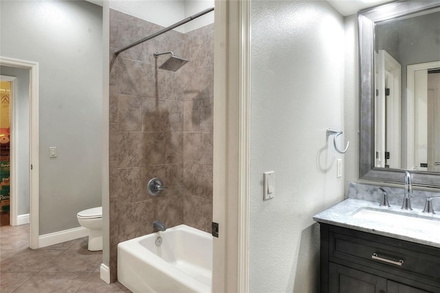 full bathroom with tile patterned floors, toilet, vanity, and tiled shower / bath