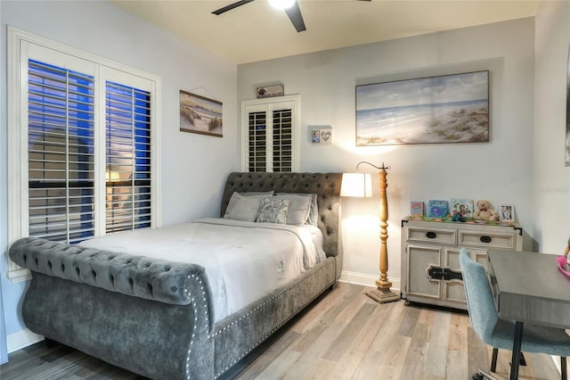 bedroom featuring hardwood / wood-style flooring and ceiling fan