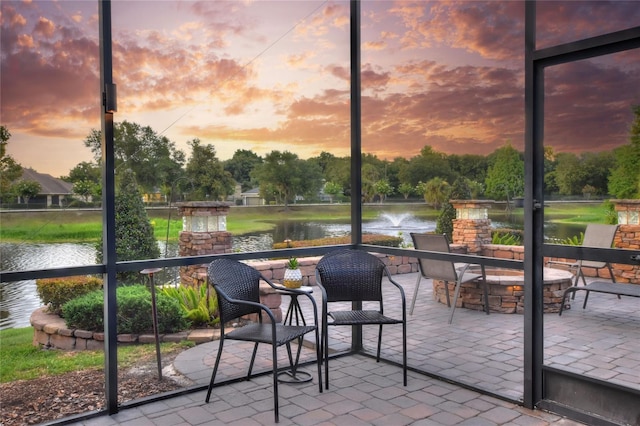 sunroom with a water view