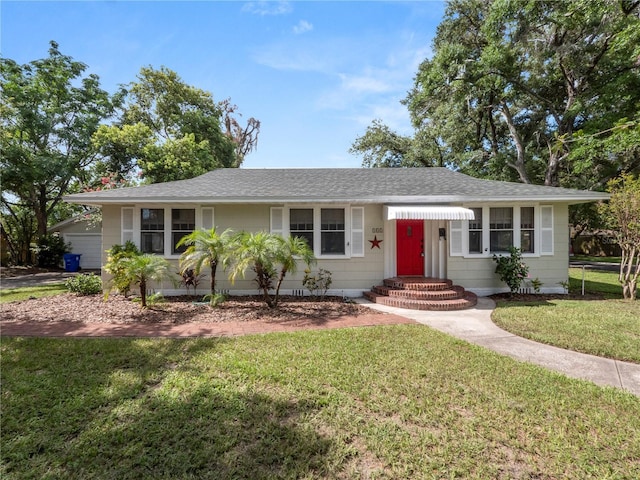 single story home with a front yard