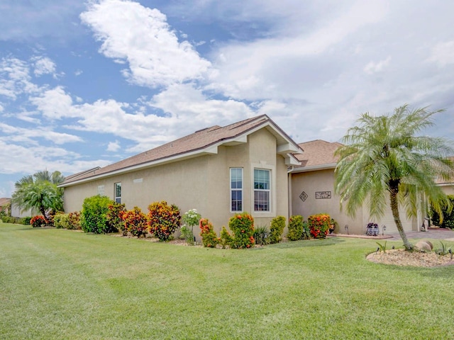 view of property exterior with a yard