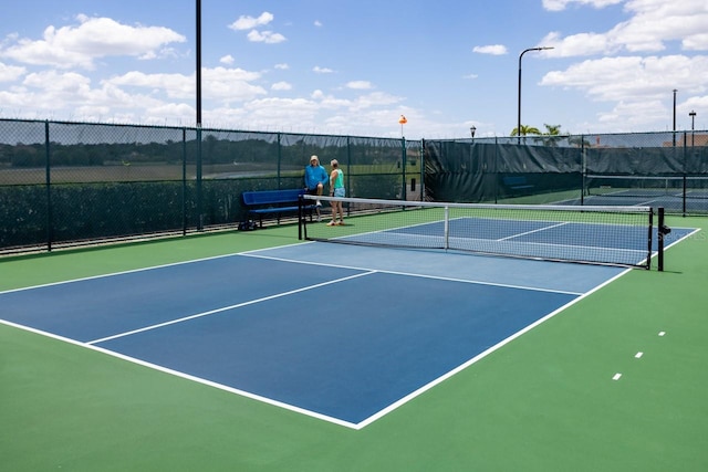 view of tennis court with basketball court