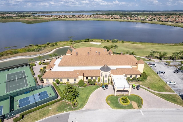 birds eye view of property with a water view