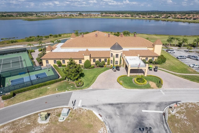 birds eye view of property with a water view