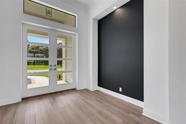 doorway to outside featuring plenty of natural light, french doors, and light wood-type flooring