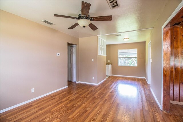 unfurnished room featuring ceiling fan and hardwood / wood-style floors